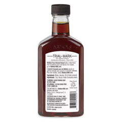 Watkins Almond Extract pour demonstrates convenient flavoring for recipes.