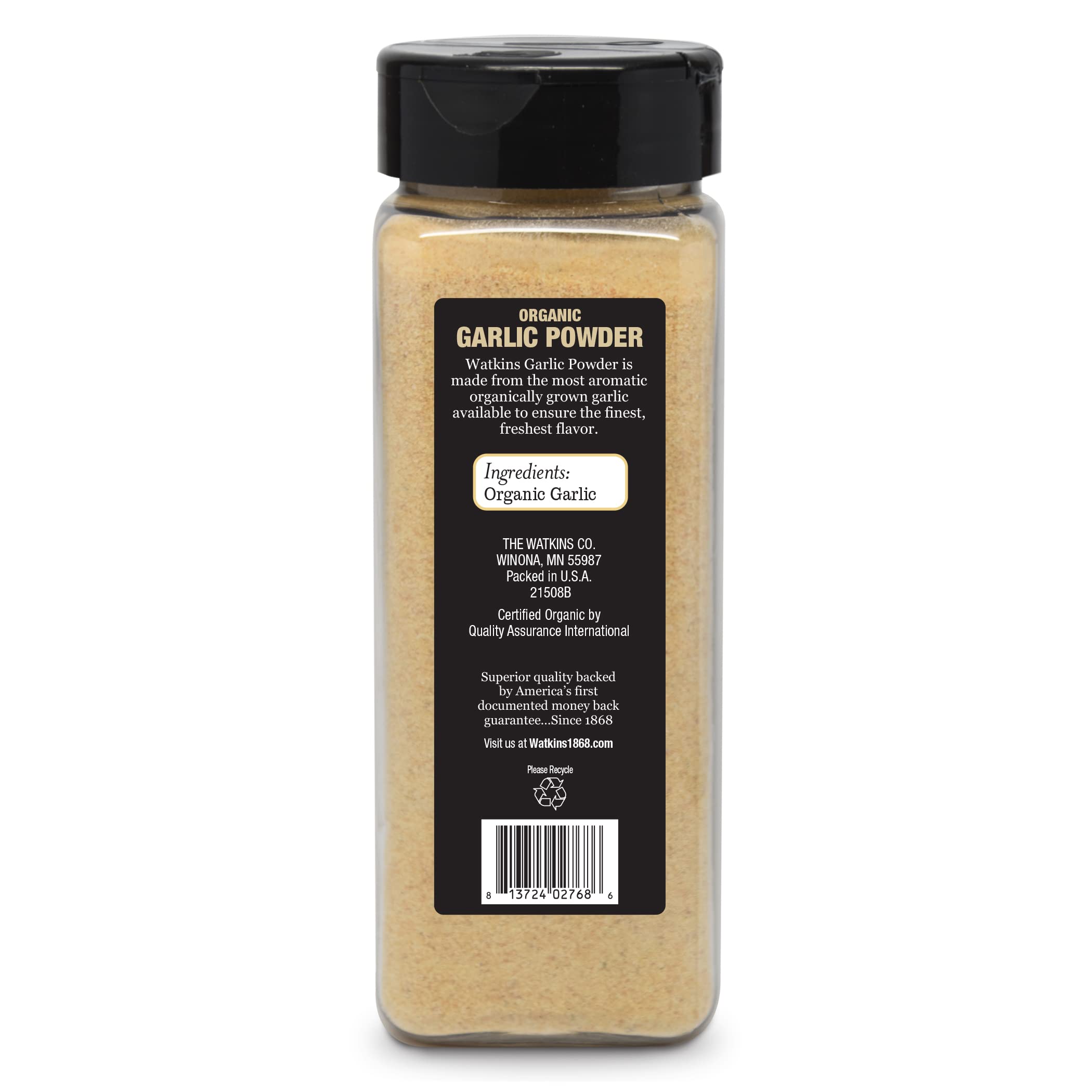 Watkins garlic powder spoon dipping into sauce for depth.