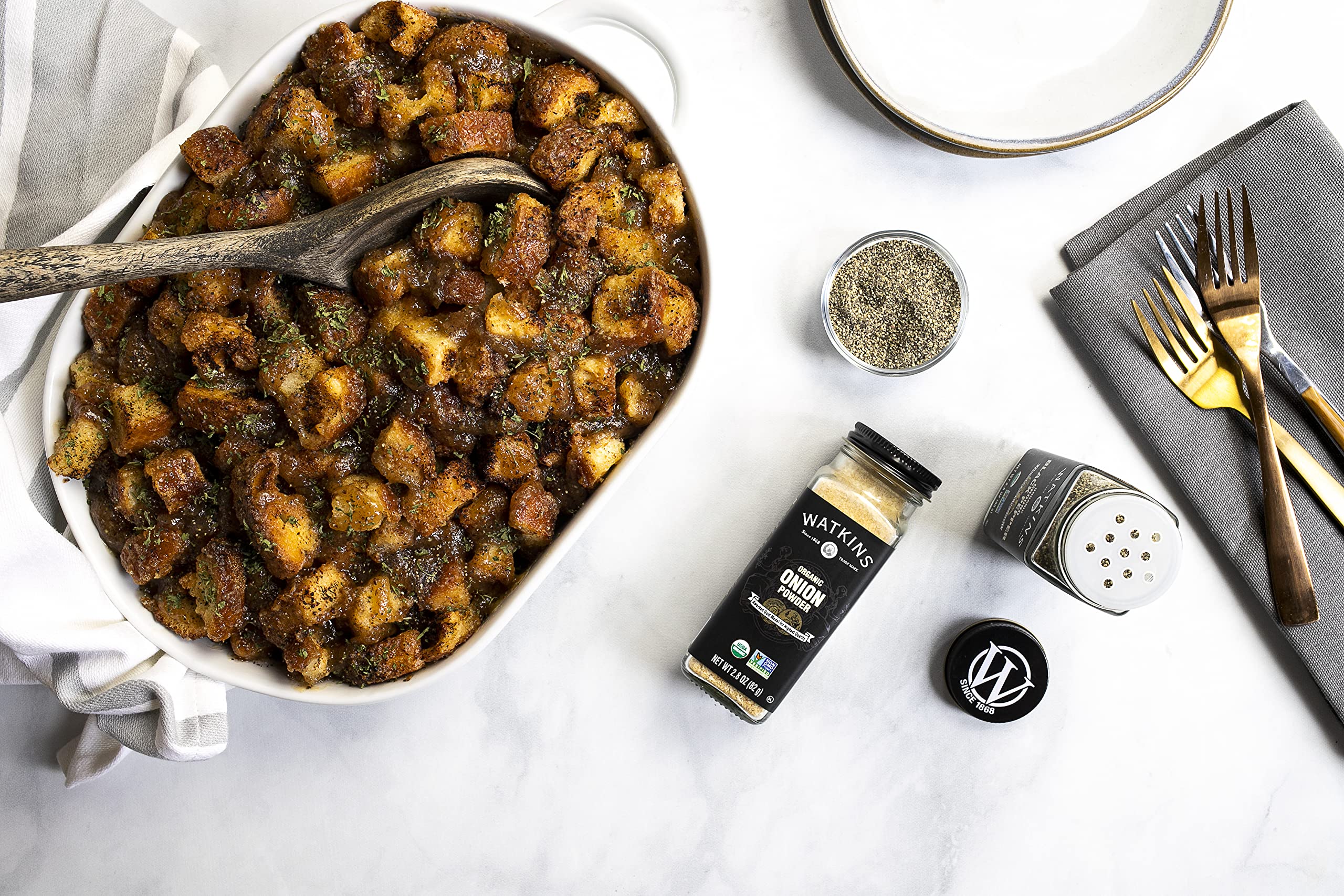 USA-packaged Watkins spices in recyclable glass bottle for eco-conscious shoppers.