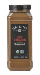 Watkins Organic Ground Cinnamon on spoon, warm aroma for baking