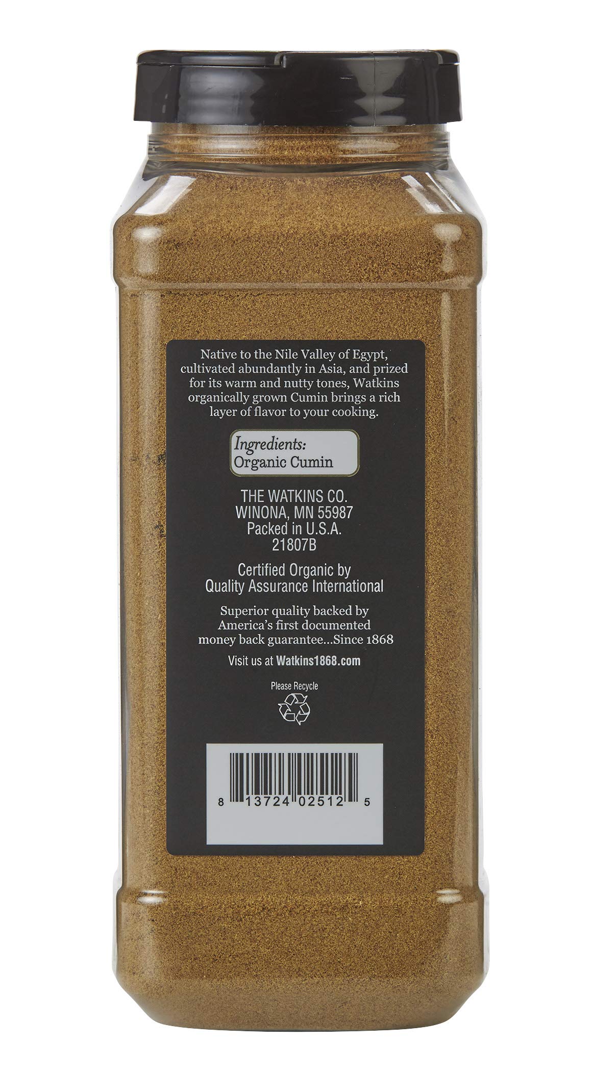 Watkins Organic Ground Cumin pour closeup, enhances curries and chili.