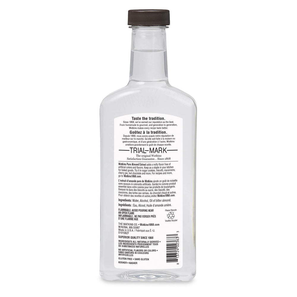 Close-up of Watkins almond extract label highlighting pure ingredients