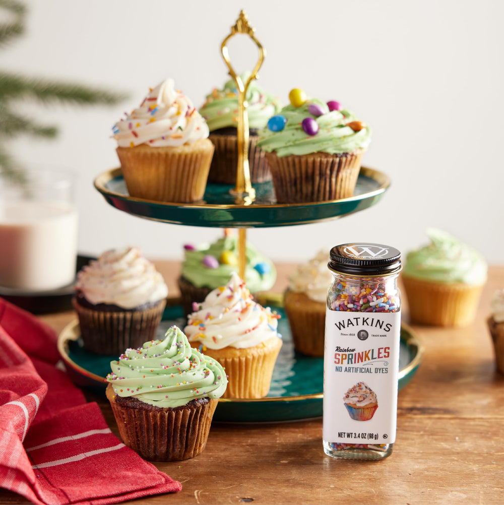 Watkins Rainbow Sprinkles over a plate of desserts adding festive color