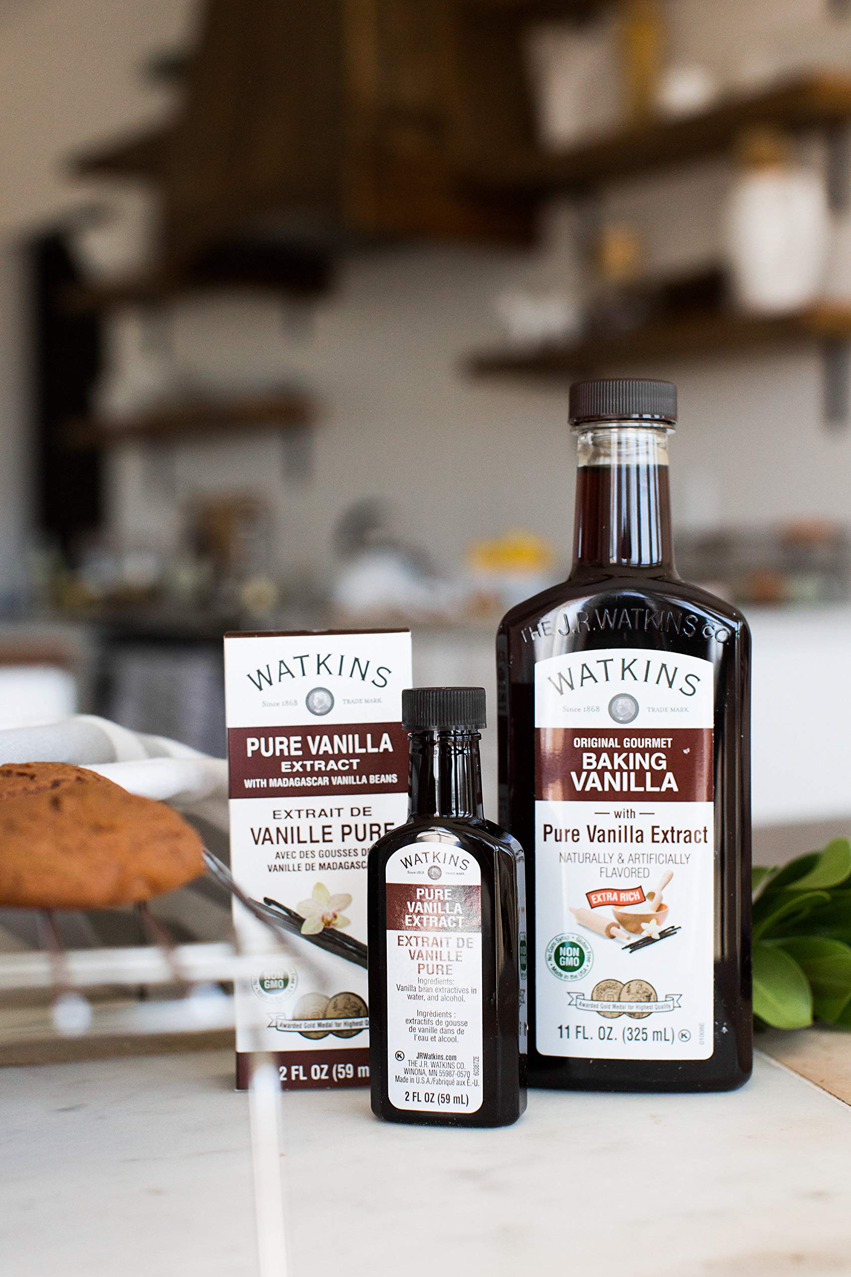 Measuring spoon with Watkins vanilla extract for precise flavor in recipes.