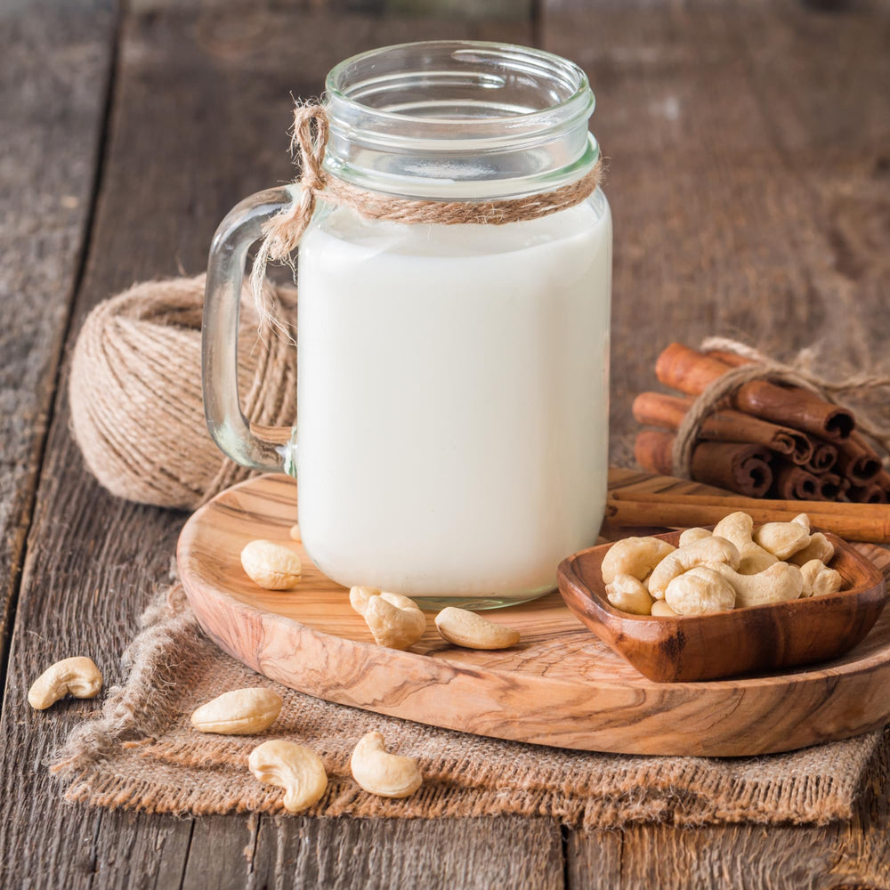 We Got Nuts cashew milk setup with raw pieces ready to blend into milk.