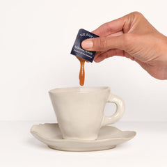 We Just Bee Manuka Snap Pack pouring into tea for premium flavor