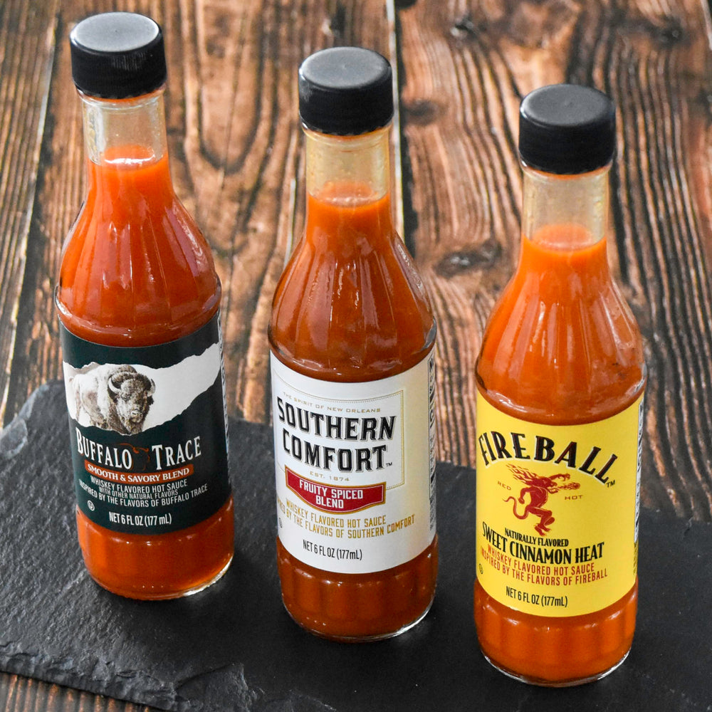 Weber Buffalo Trace hot sauce on grilled meats for enhanced flavor.