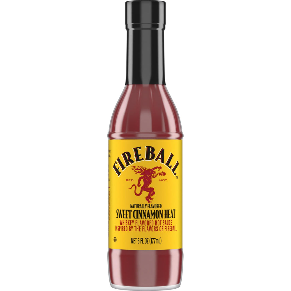 Weber Fireball hot sauce bottle on grill, ideal for bold wings and ribs.