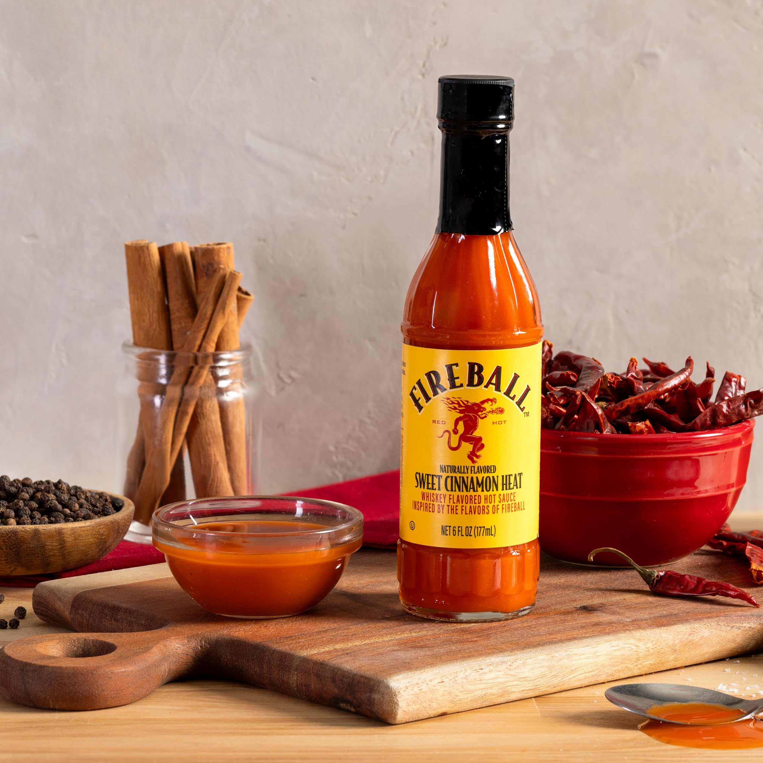 Weber Fireball hot sauce with ribs offering a bold glaze option.