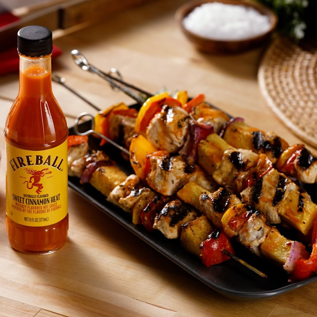 Weber Fireball sauce on a tailgate spread adding smoky sweetness.