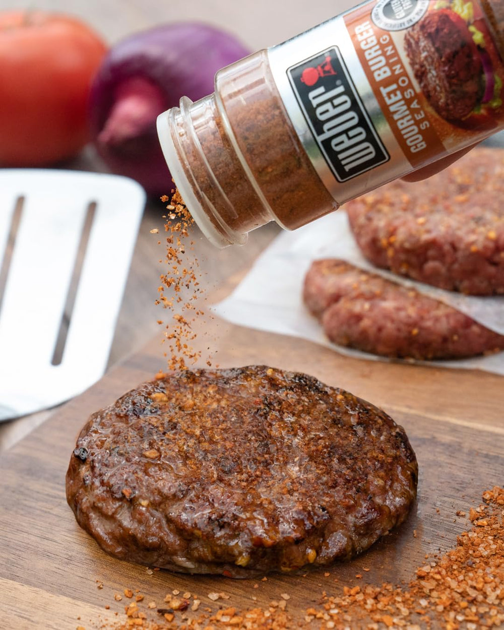 Weber Gourmet Burger Seasoning bottle viewed from side angle.