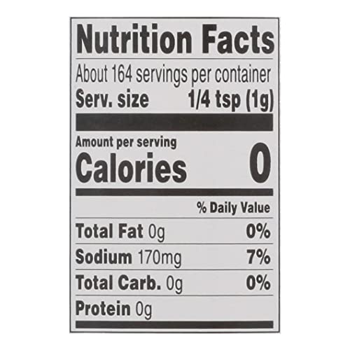 Weber Gourmet Burger Seasoning sprinkled on a raw patty for flavor.