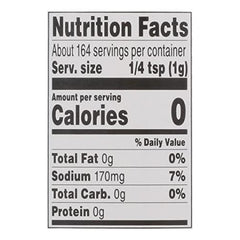 Weber Gourmet Burger Seasoning sprinkled on a raw patty for flavor.