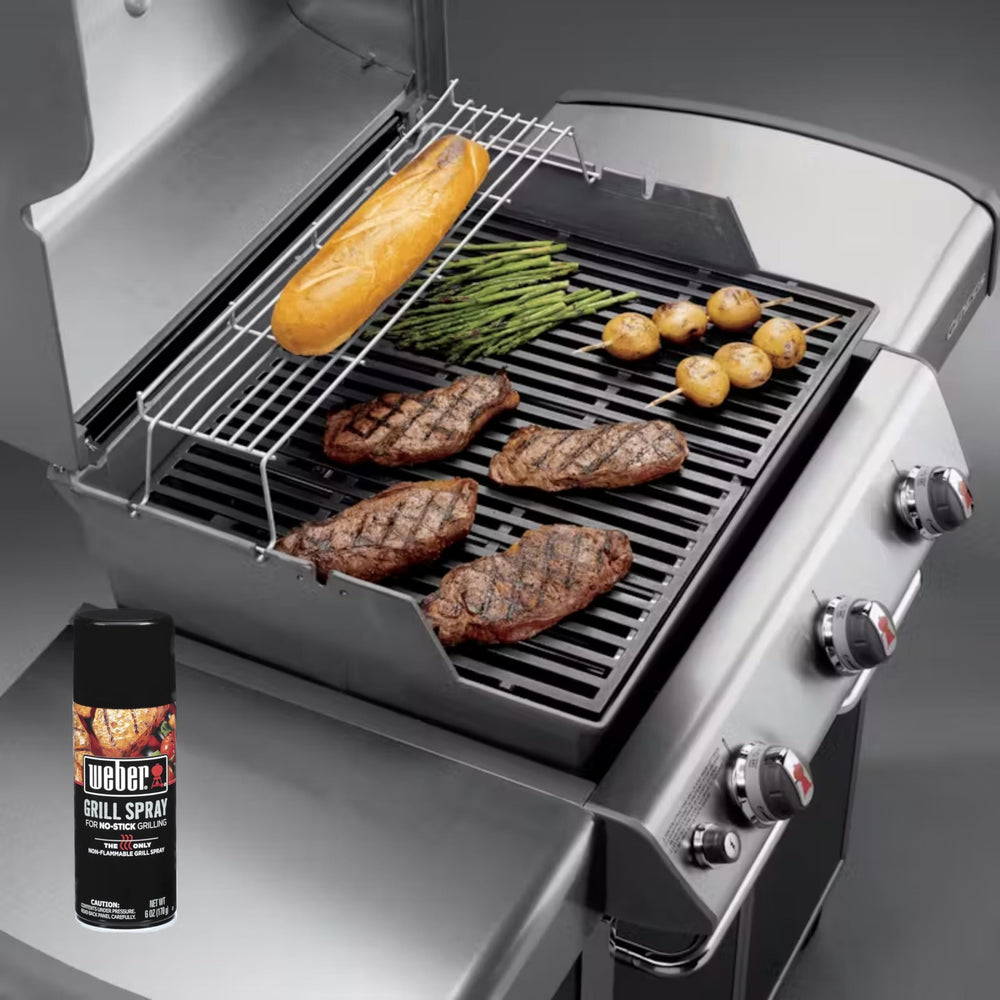 Weber Grill'N Spray 6 Oz held in hand for quick grill lubrication