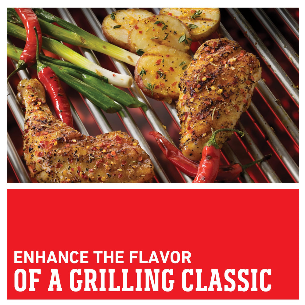 Weber Kick'n Chicken Seasoning on chicken grilling over an open flame