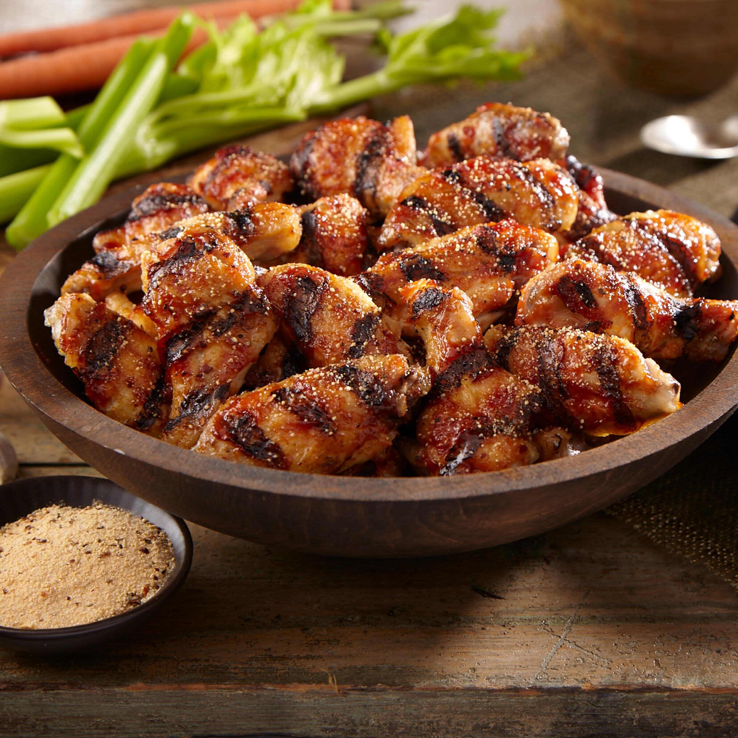 Weber Roasted Garlic & Herb Seasoning in use during family barbecue