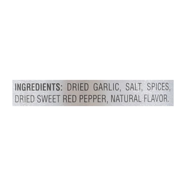 Weber Roasted Garlic & Herb Seasoning on sizzling steak for rich flavor