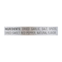 Weber Roasted Garlic & Herb Seasoning on sizzling steak for rich flavor