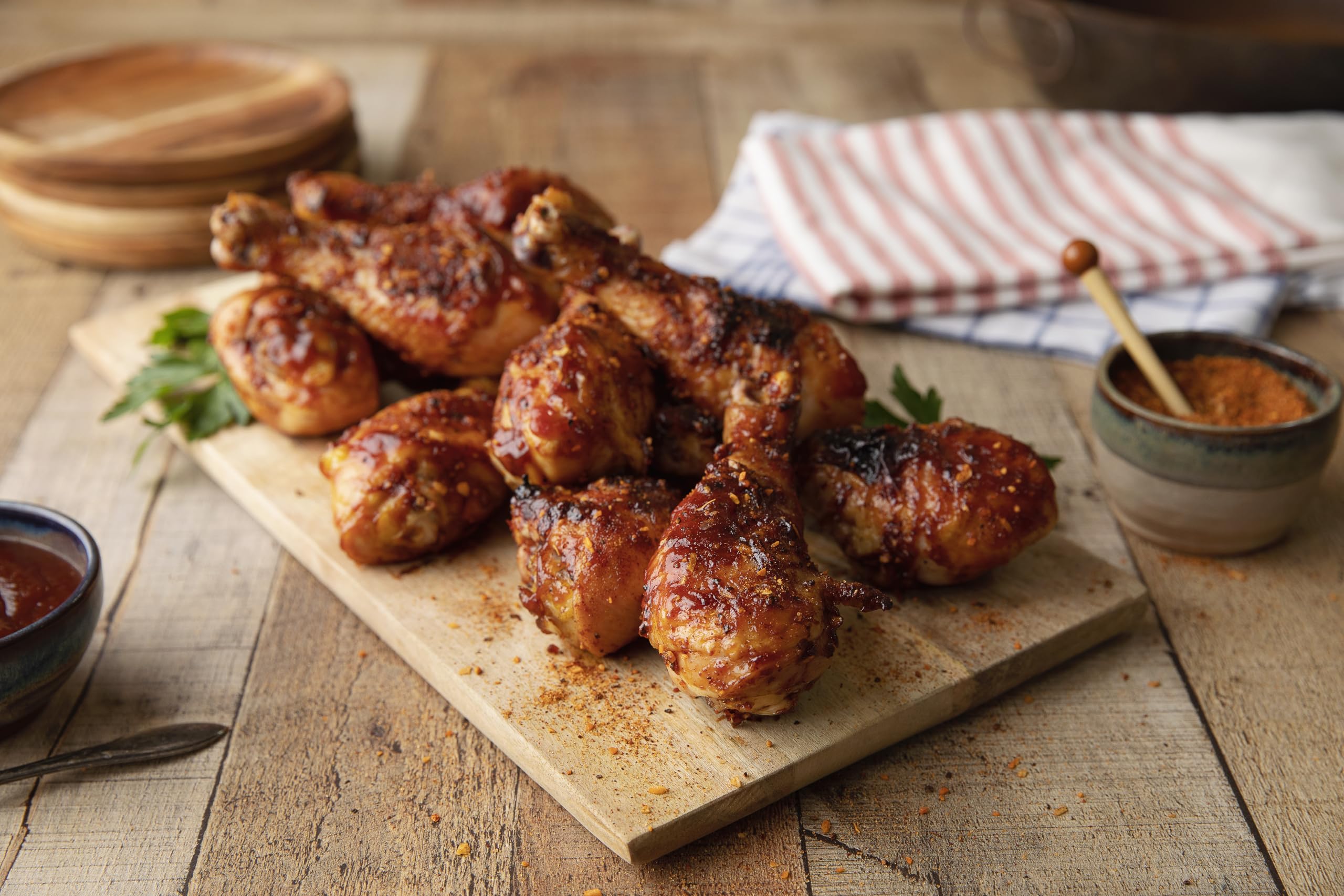 Grill-side scene featuring Weber Smokey Mesquite Seasoning for backyard cooking.