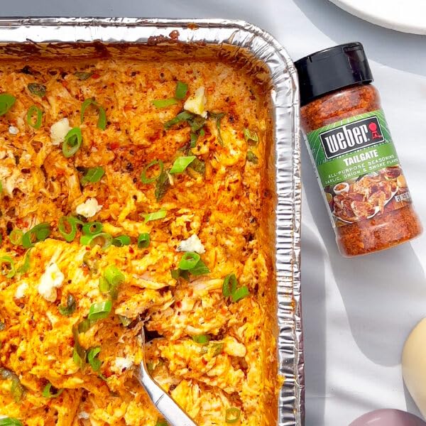 Weber Tailgate Seasoning at a tailgate table offers ready-to-use flavor.