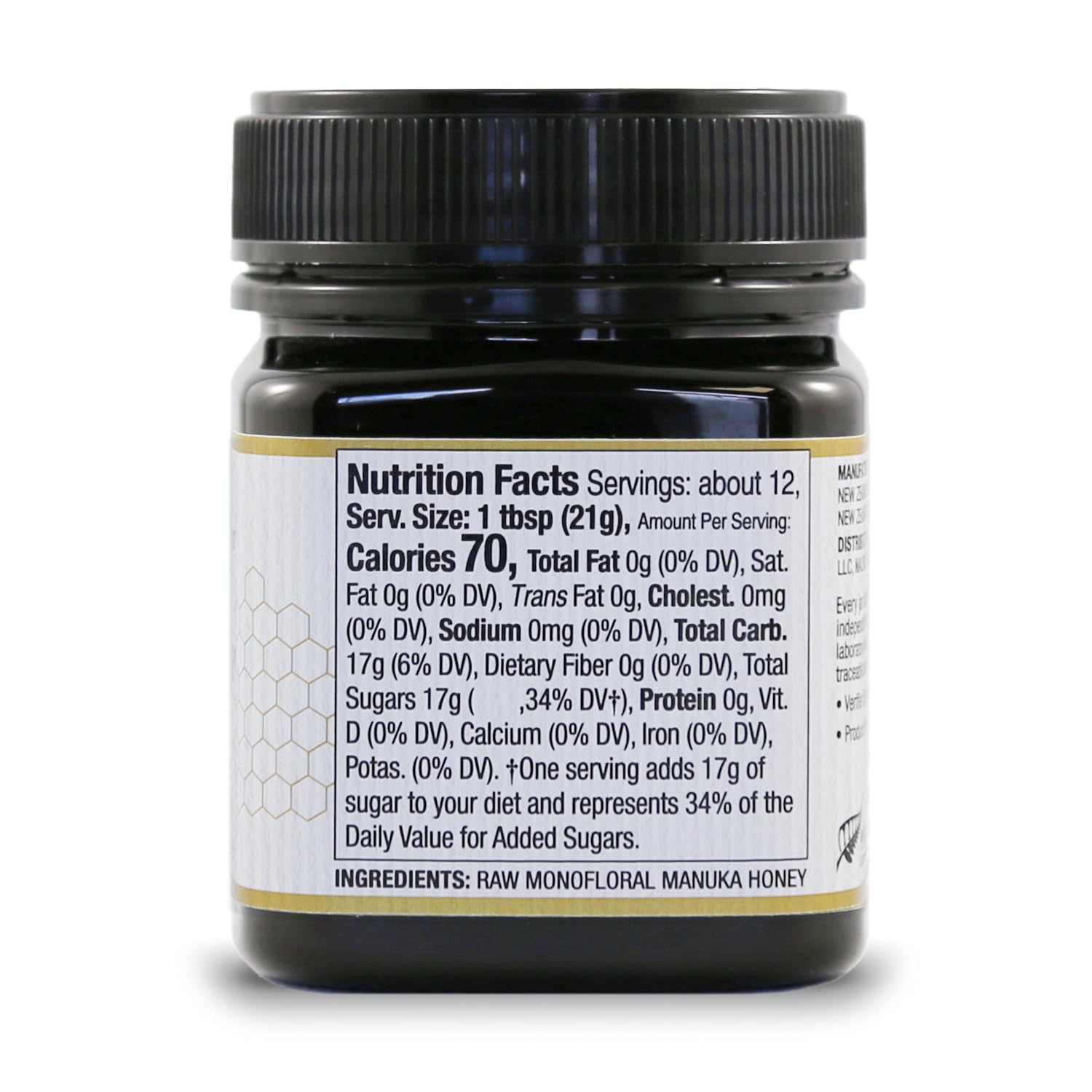 Closeup of Wedderspoon jar showcasing creamy Manuka texture and bold flavor.