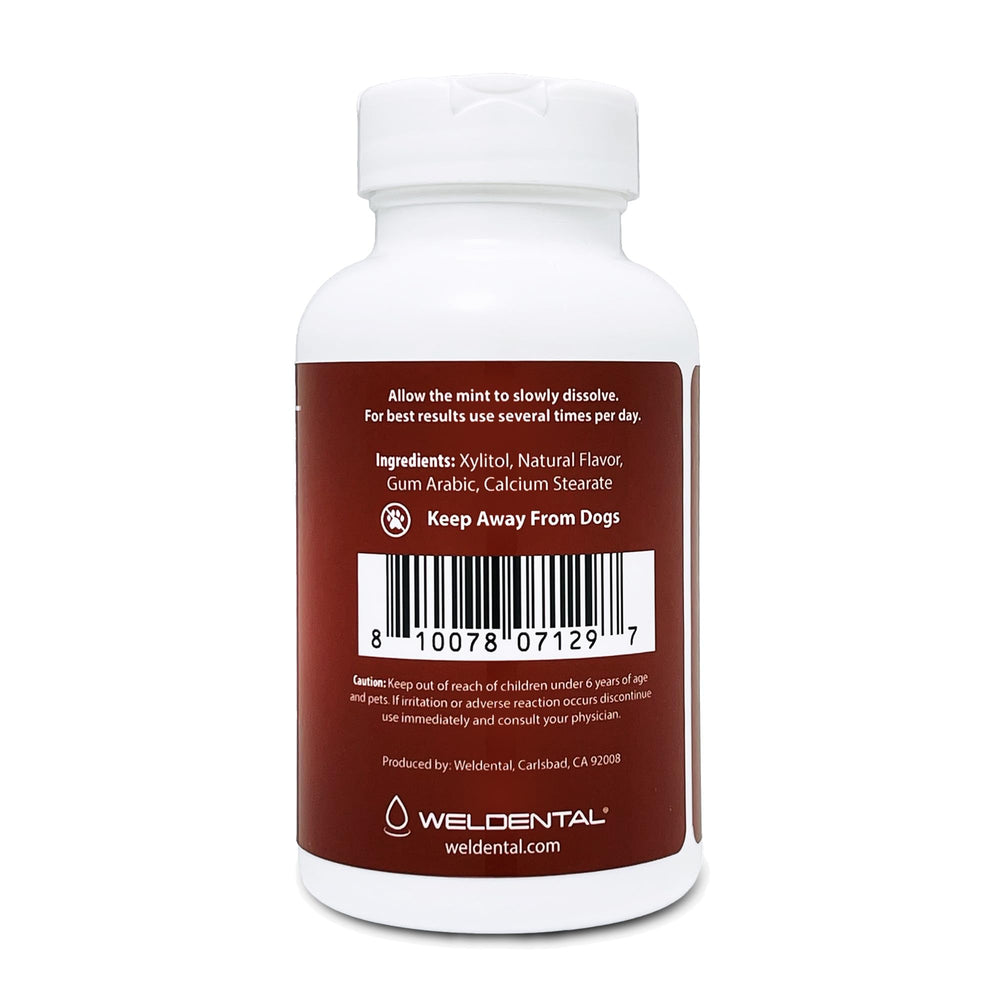 WELdental Xylitol Mints Cinnamon close-up shows smooth texture and bite
