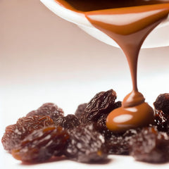 Sun-dried raisins visible through chocolate on Wellsley Farms product for a chewy bite.