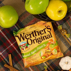 Werther's Original caramel apple-filled bags displayed on a table.