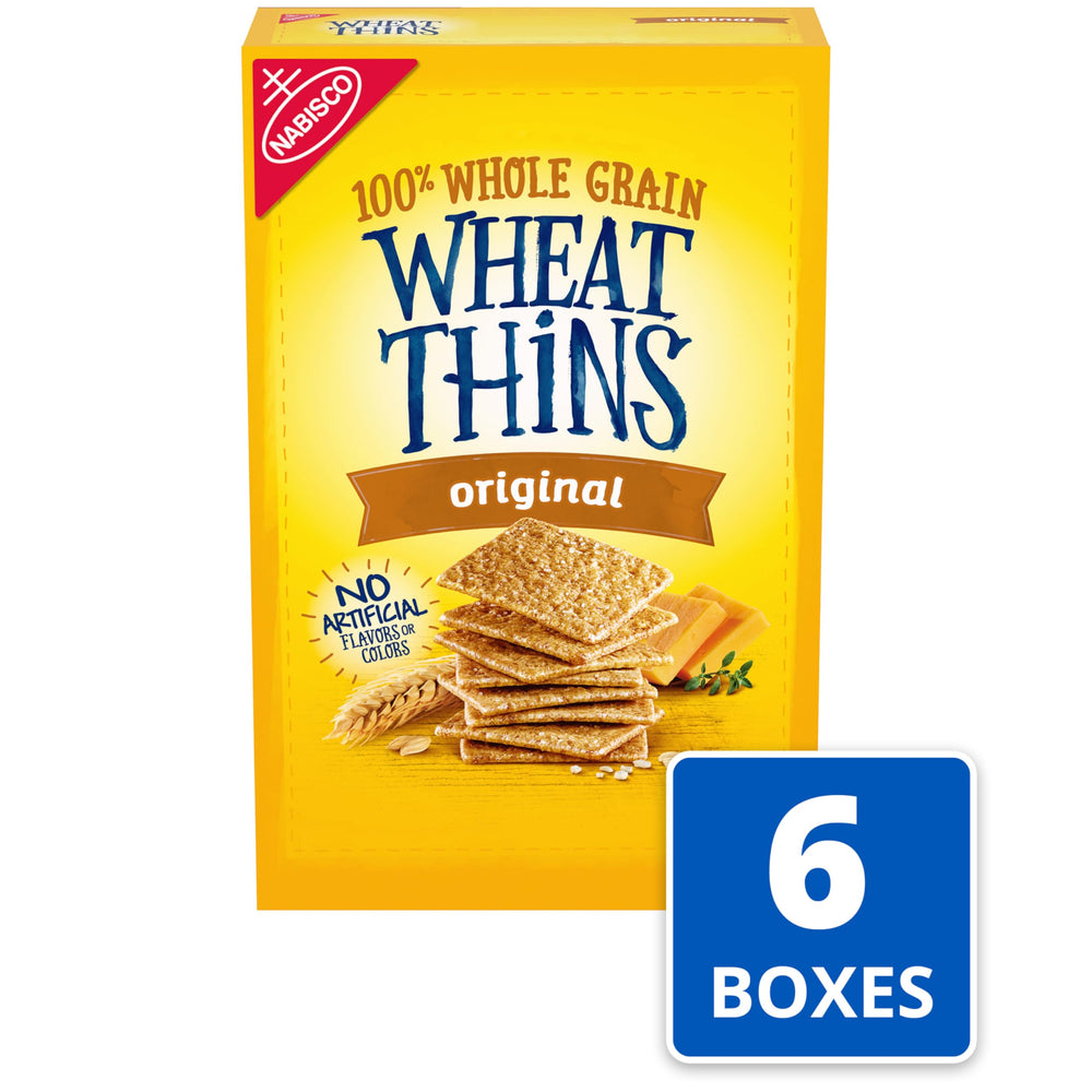 Wheat Thins Original on a cheese board with assorted cheeses.