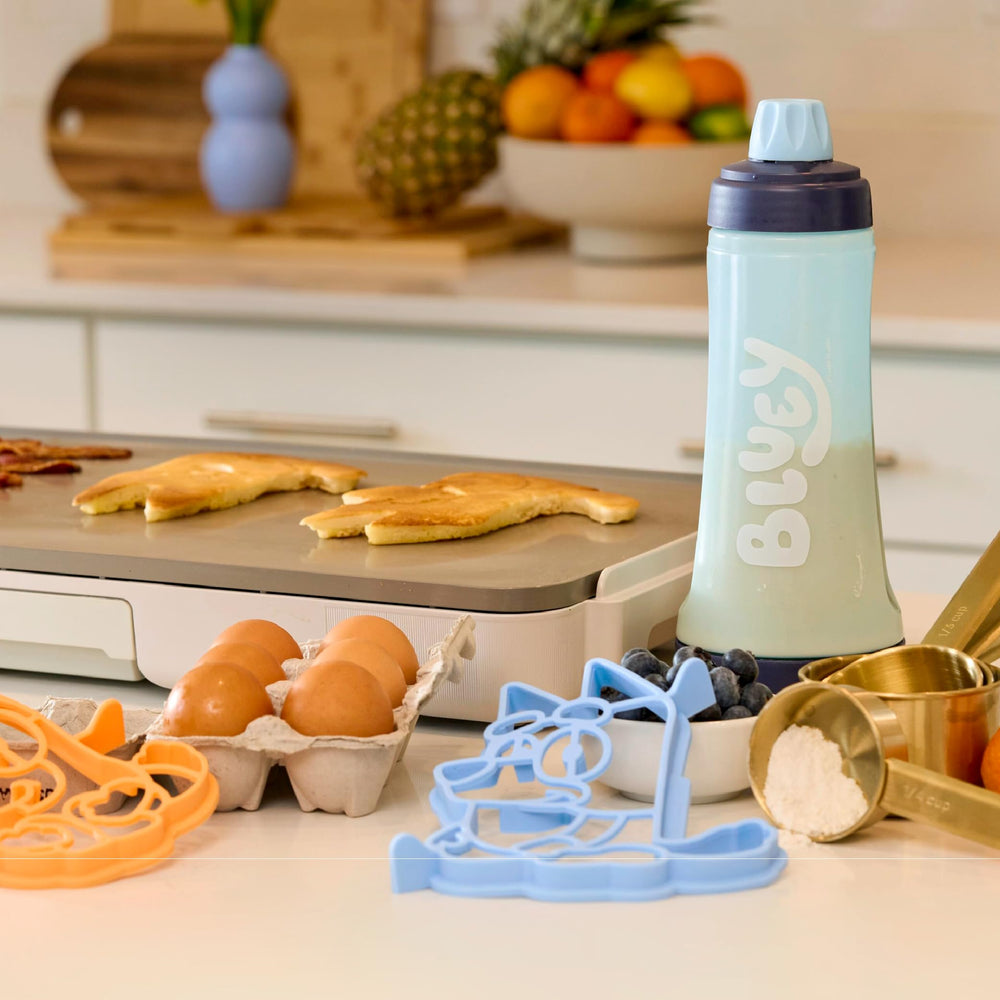 Whiskware pancake art kit in use on a griddle for creative shapes