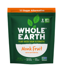 Whole Earth Monk Fruit Sweetener with Erythritol jar on kitchen counter for baking and cooking.