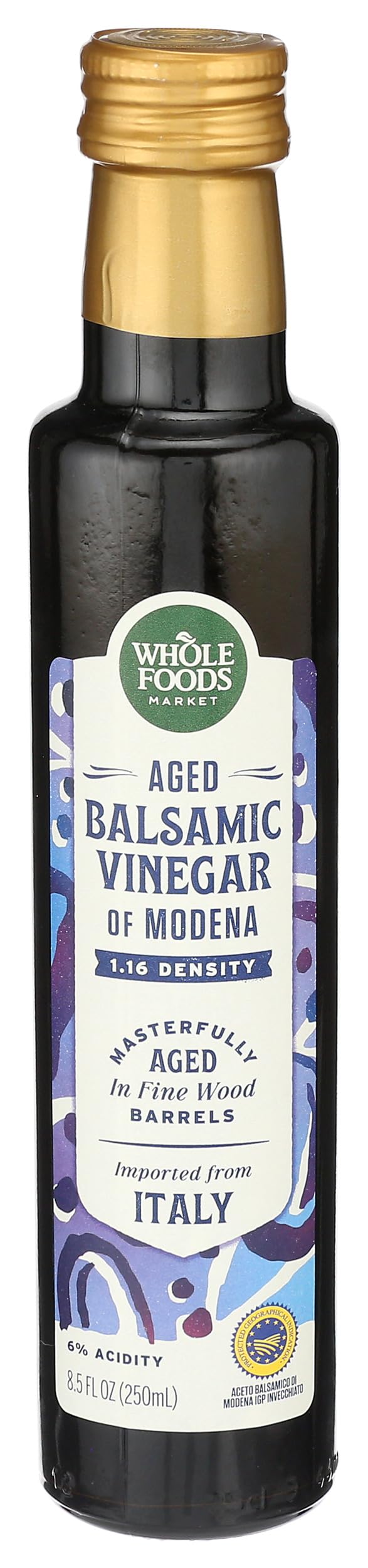 Whole Foods Market aged balsamic vinegar of Modena bottle with rich color for finishing dishes.
