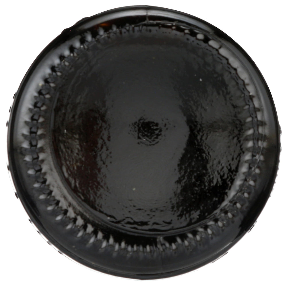 Whole Foods Market Modena balsamic bottle pouring over vegetables hints at drizzling use.