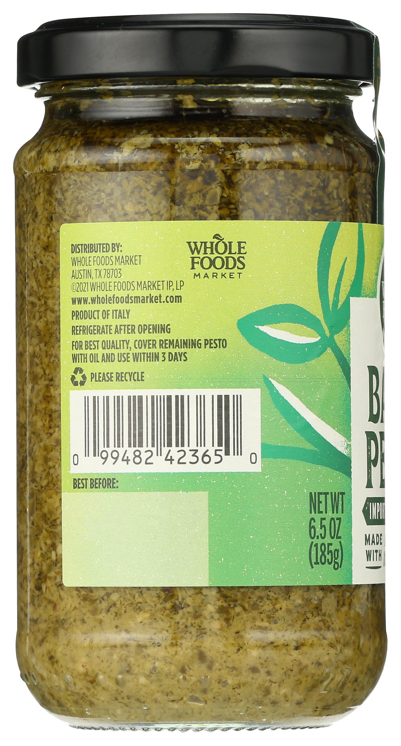 Whole Foods Market Basil Pesto in a glass bowl with cheese.