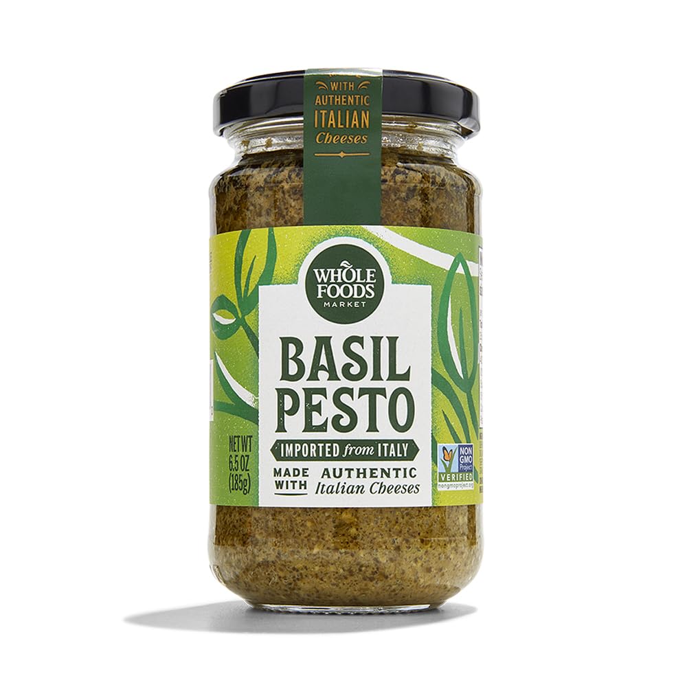 Whole Foods Market Basil Pesto jar close-up, ideal for pasta.