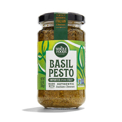 Whole Foods Market Basil Pesto jar close-up, ideal for pasta.