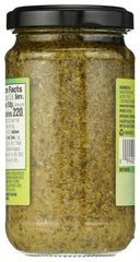 Whole Foods Market Basil Pesto bottle tilted, ready to pour.