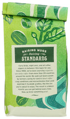 Whole Foods Market El Volcan light roast beans close-up with bright aroma.
