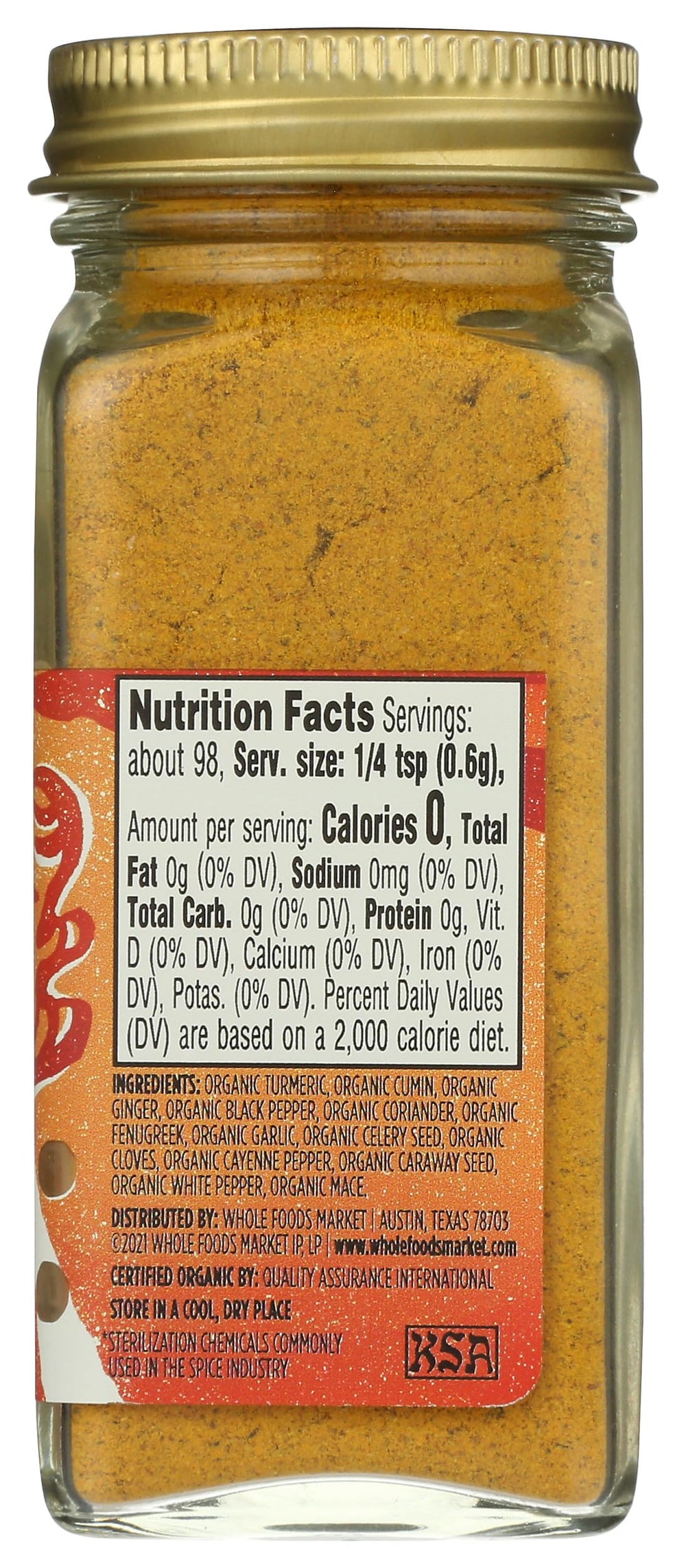 Kitchen scene with Whole Foods Market Muchi curry seasoning conveys premium spice blend for vibrant sauces