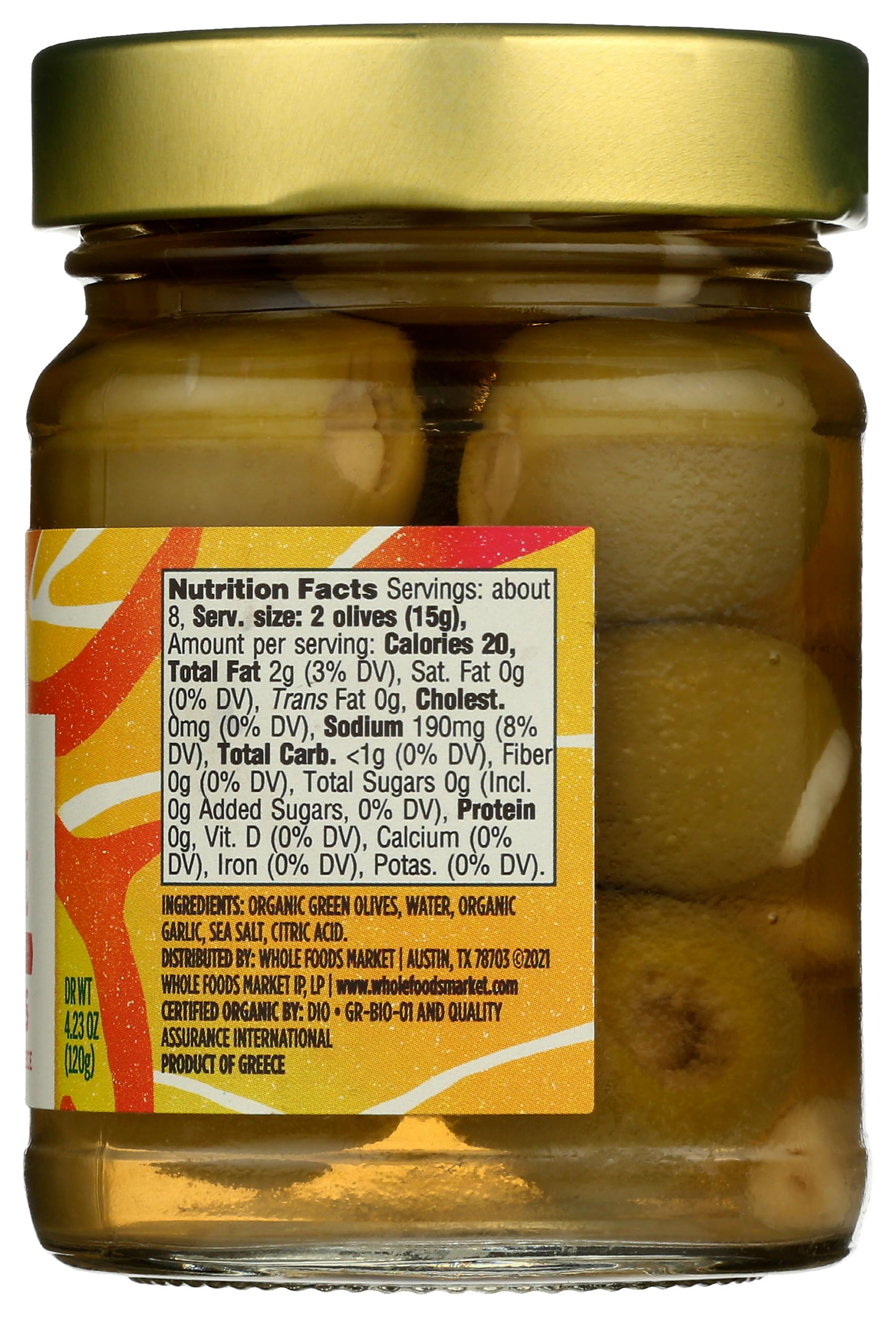 Whole Foods Market organic garlic stuffed olives front label shows ingredients and Non-GMO verification.