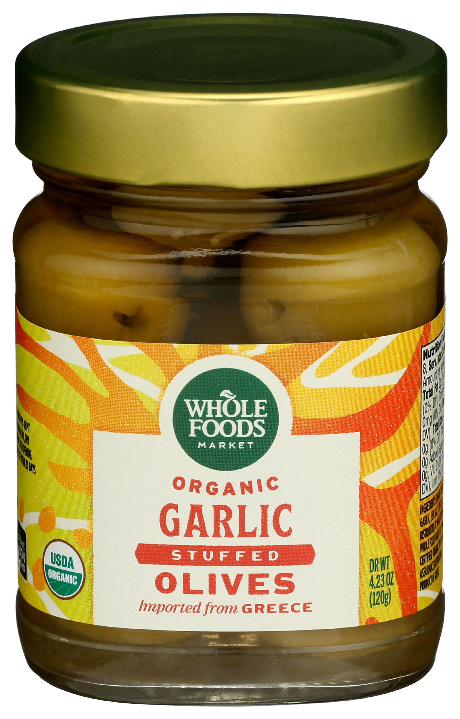 Whole Foods Market organic garlic stuffed olives in a jar, ideal for quick appetizers and snacking.