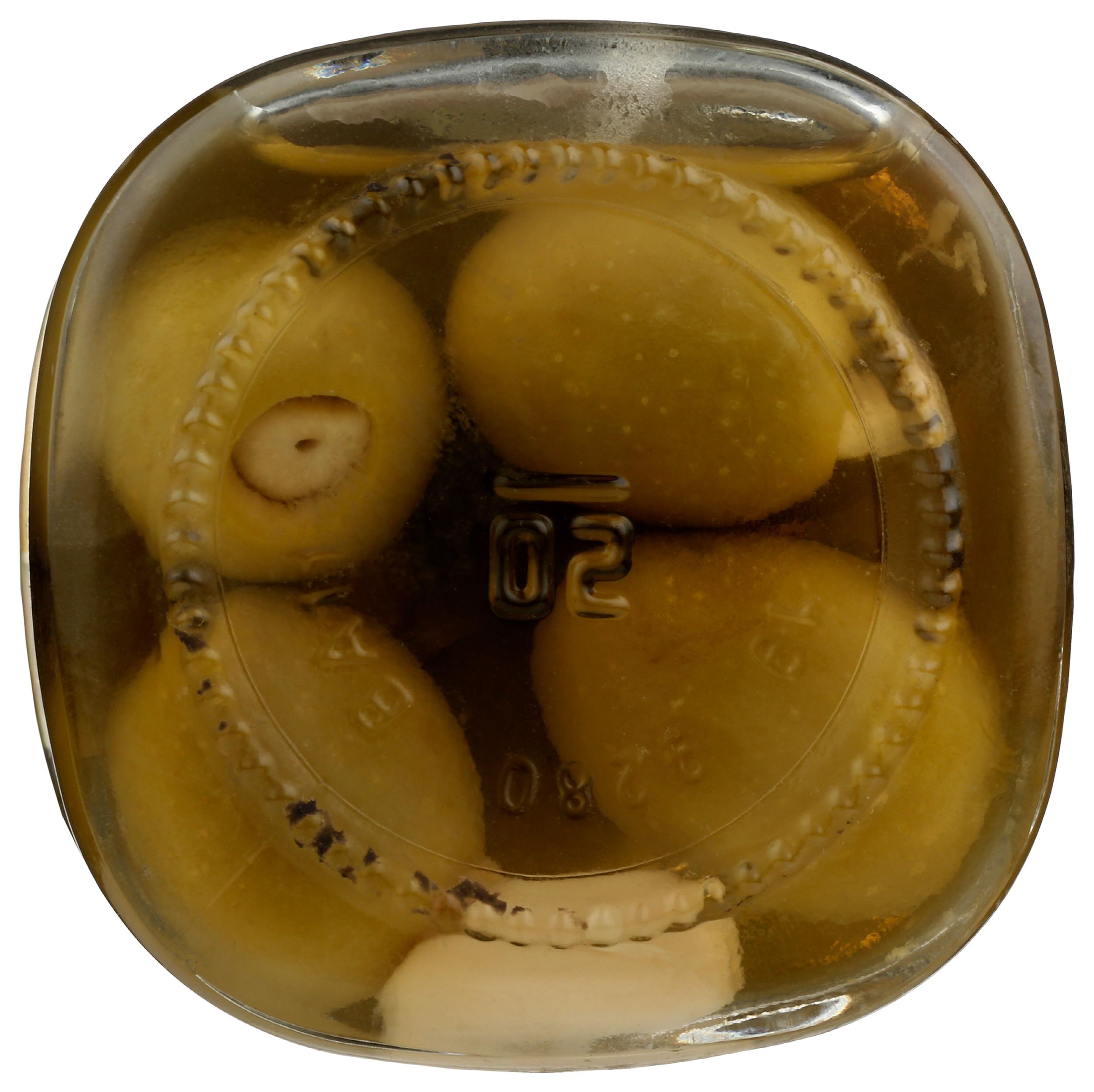 Whole Foods Market garlic stuffed olives macro texture showing filling and olive skin.