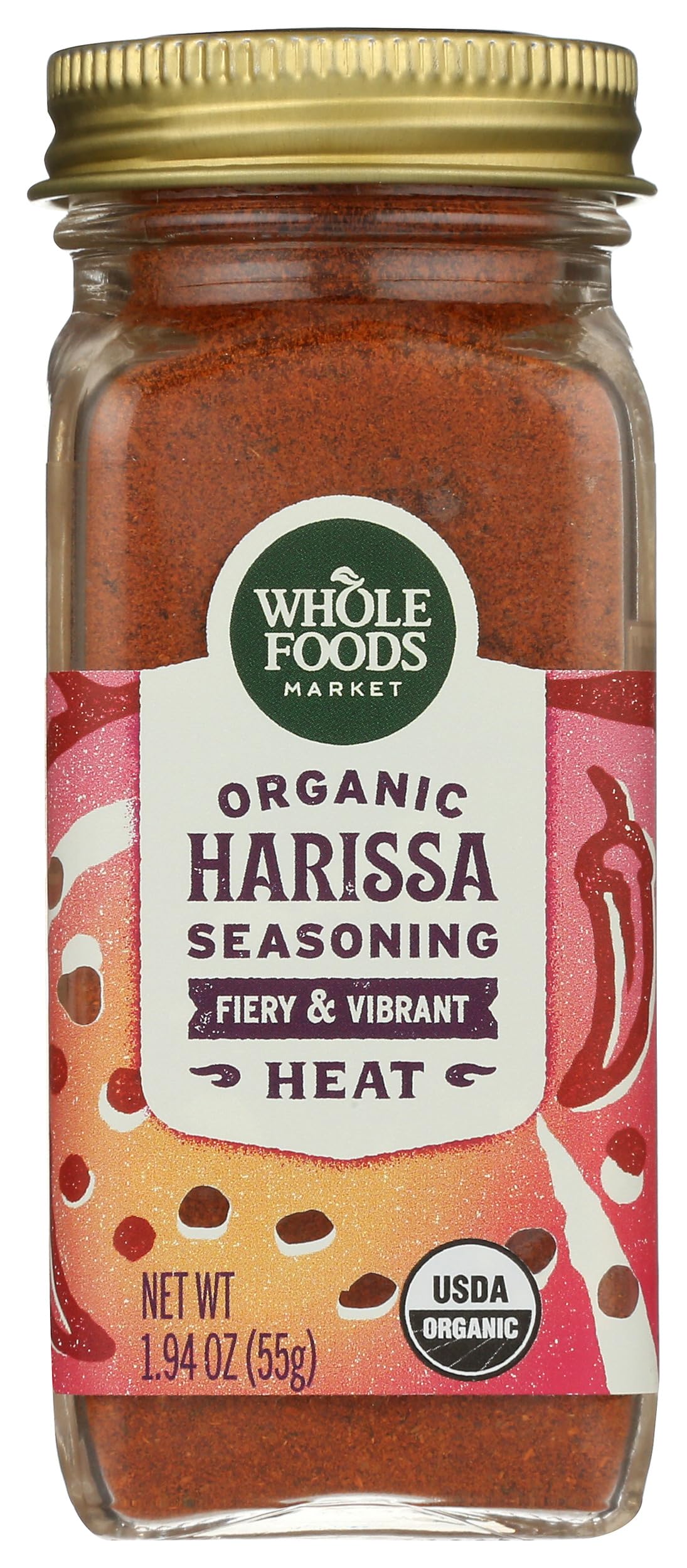 Whole Foods Market organic harissa seasoning in glass jar for flavorful meals.