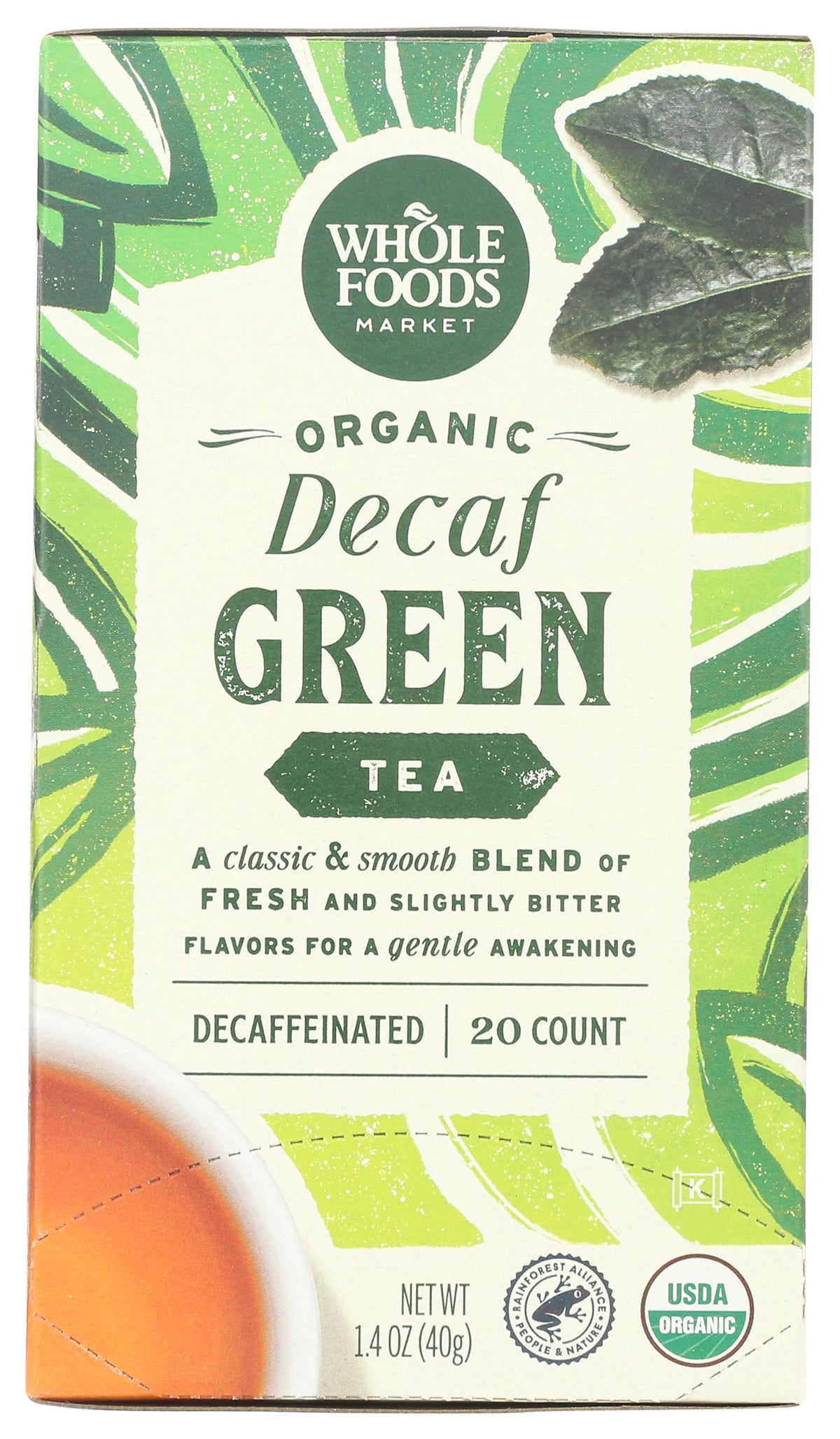 Whole Foods Market green decaf organic tea packaging highlights freshness and organic origin.
