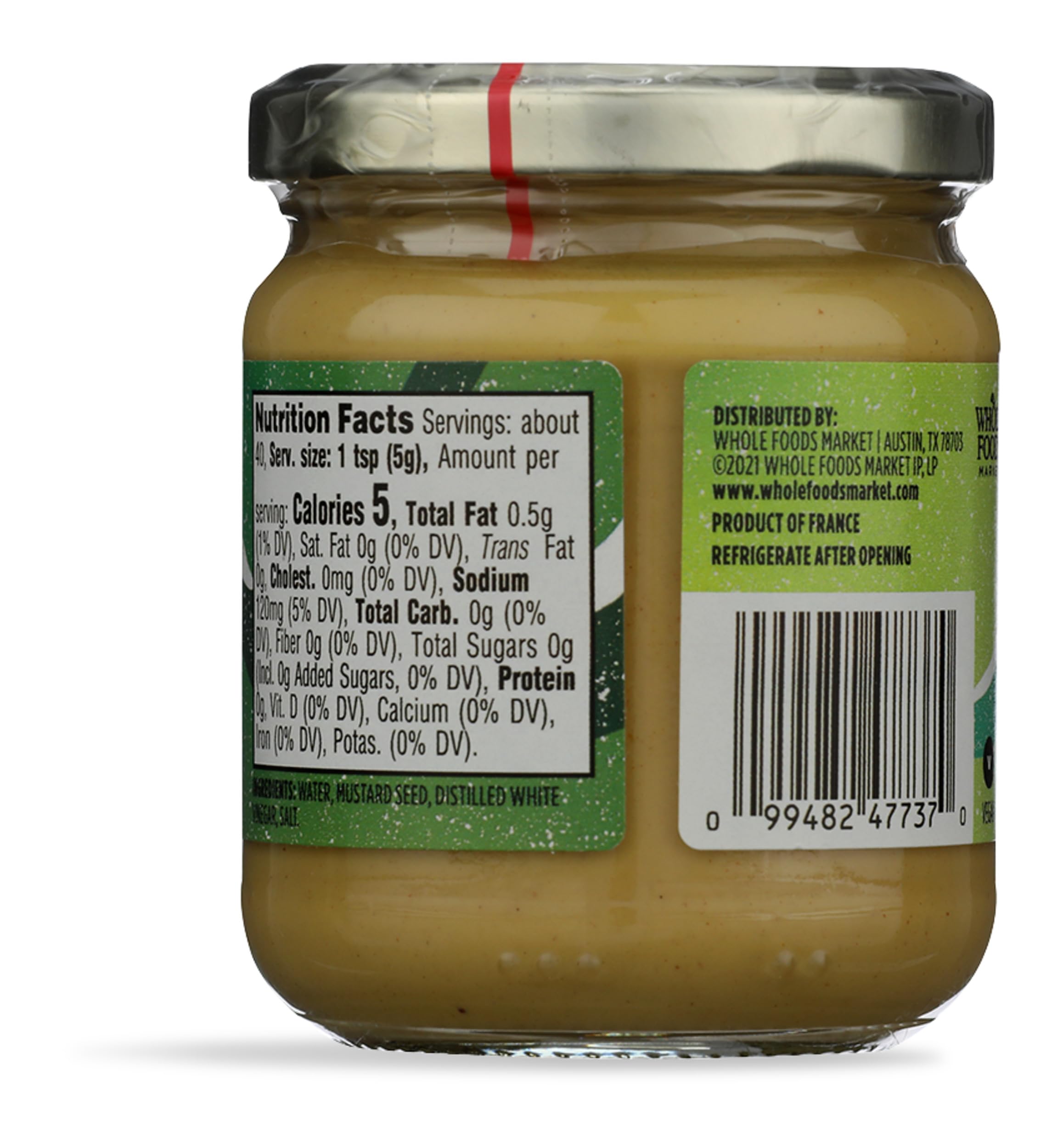 Whole Foods Market Dijon mustard bottle ready to elevate sauces and dressings.