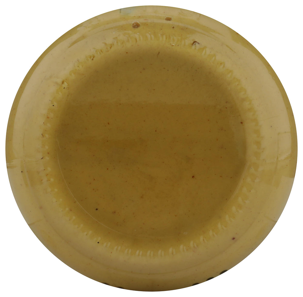 Whole Foods Market traditional Dijon mustard closeup emphasizing texture and color.
