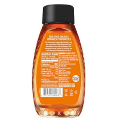 Wholesome Organic Raw White Honey bottle side label close-up showing certifications.