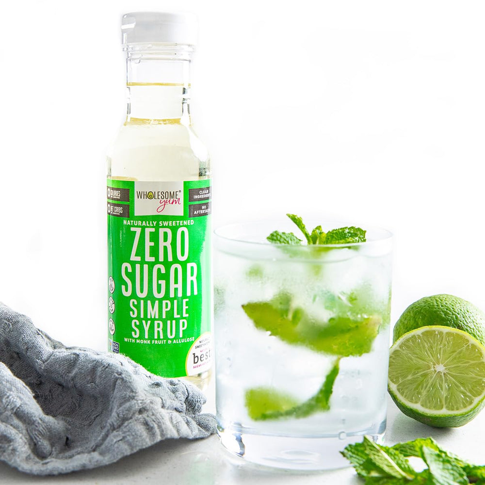 Wholesome Yum Keto Simple Syrup cocktail glass with drizzle.