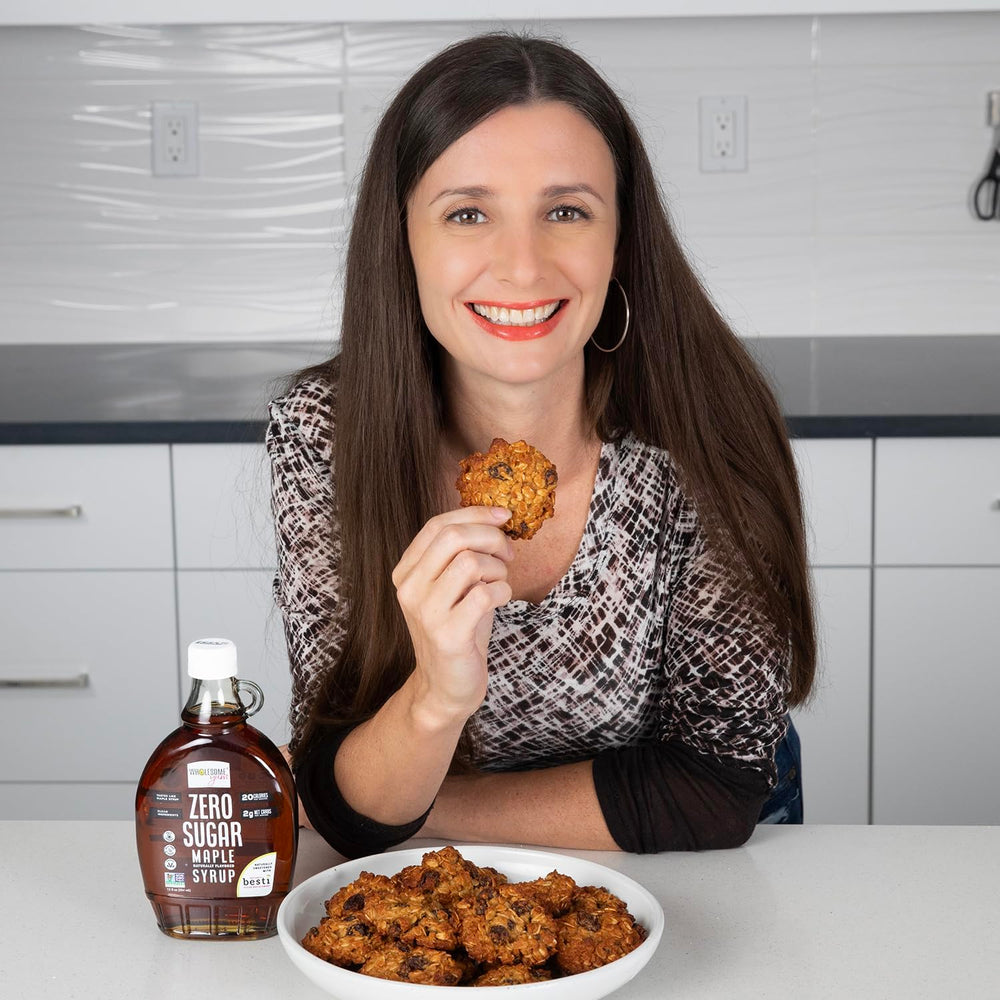 Wholesome Yum sugar-free maple syrup pour over pancakes and berries.