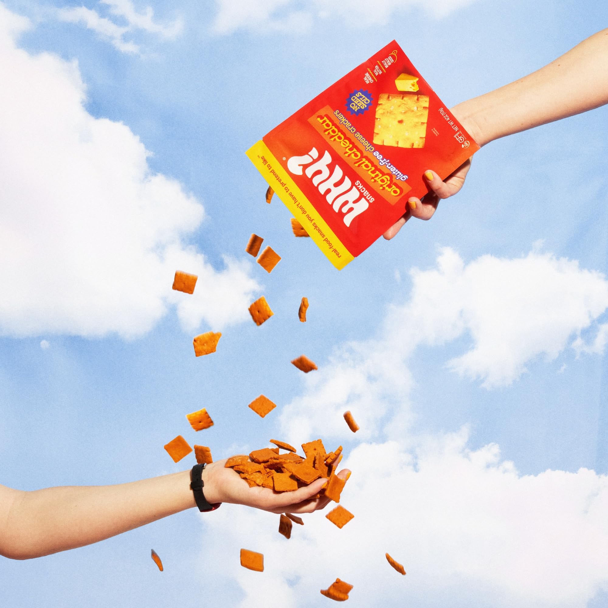 WHY? SNACKS bag opened to reveal crisp crackers and visible texture.